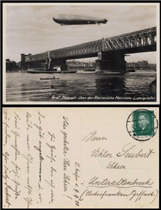 POSTCARD Zeppelin airship flying over the Mannheim Bridge (1930)